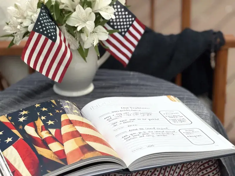 Handwritten holiday traditions in an open Harvest book.